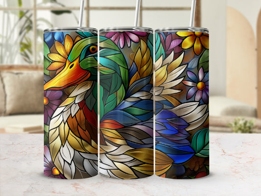 Colorful stained glass duck design on three tumblers with straws.
