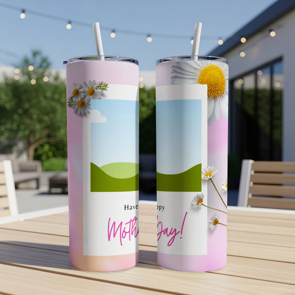 Two tumblers with daisies and "Happy Mother's Day" text displayed outdoors.
