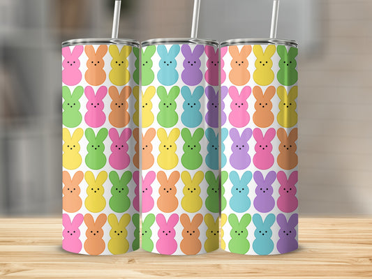 Easter bunny pattern tumbler with colorful bunnies and white straws.
