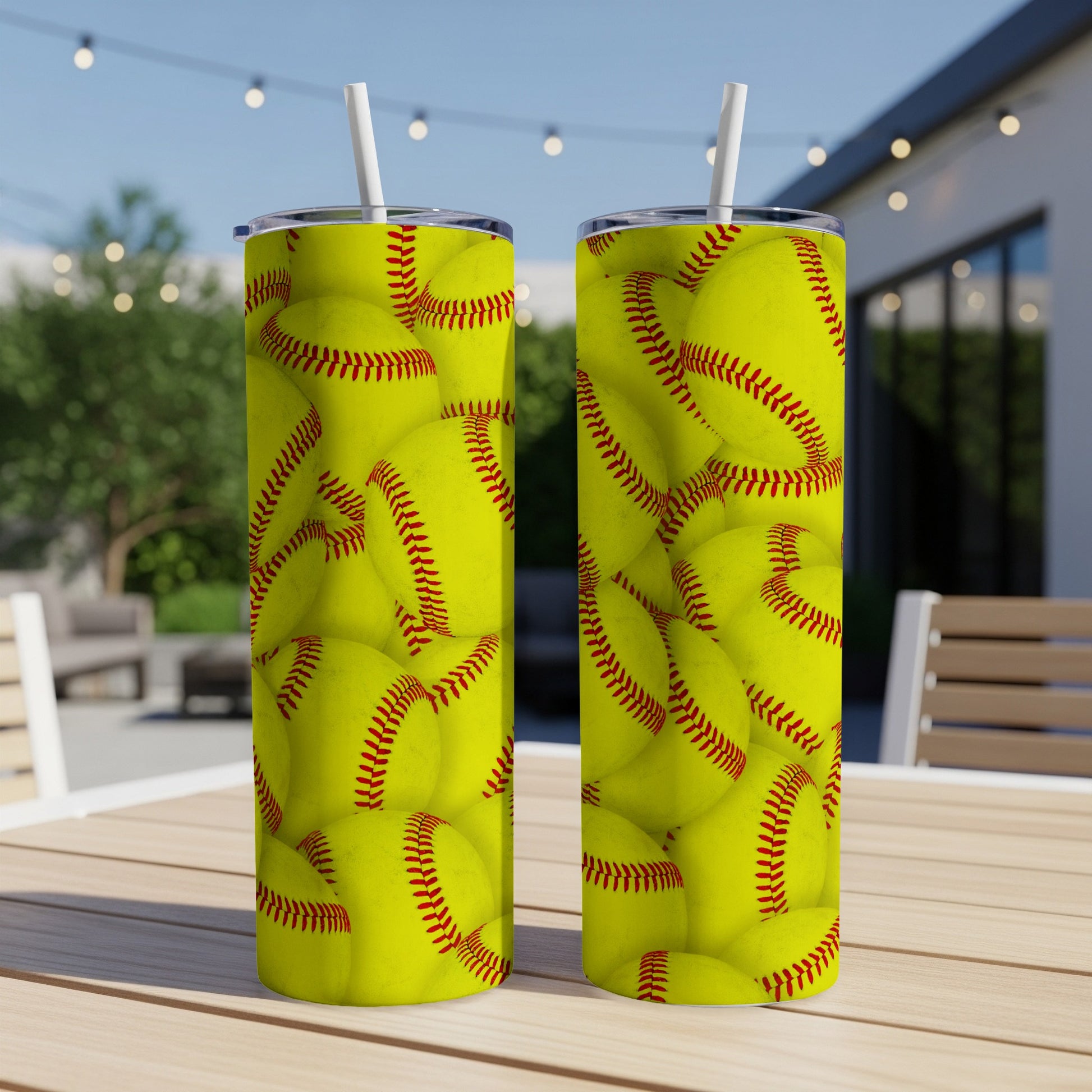 Two tumblers with a full-coverage print of yellow softballs.
