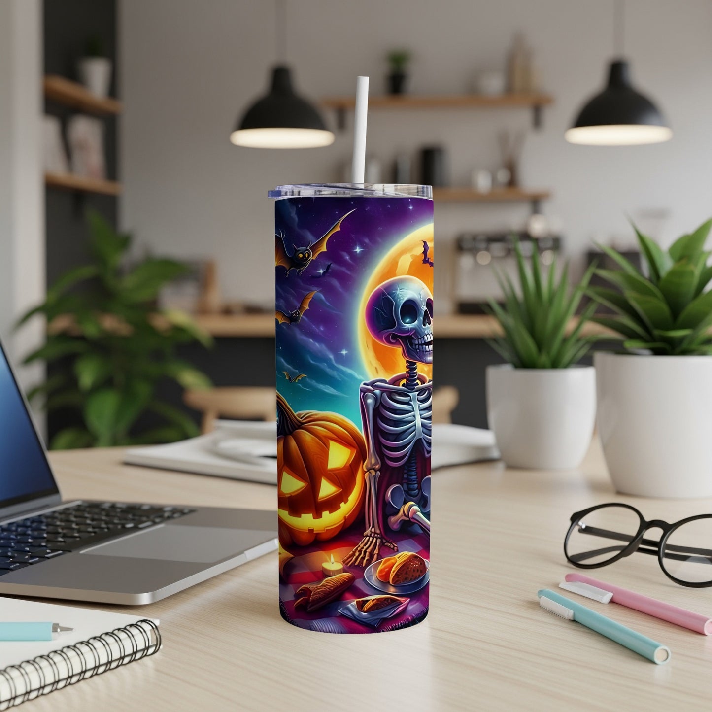 Halloween tumbler with skeleton, pumpkin, bats, and moon illustration.