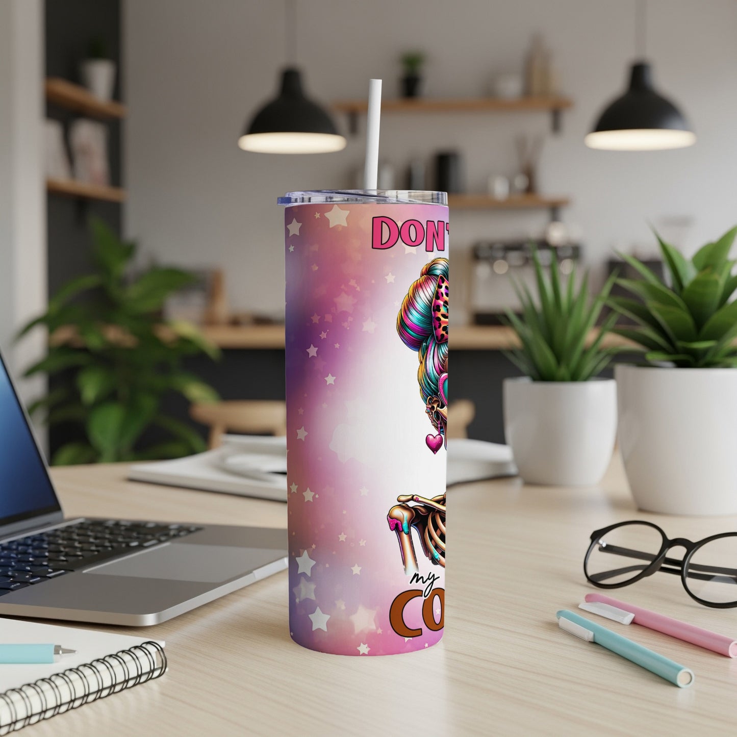 Pink tumbler with colorful skull and stars, "Don't talk to me before my coffee" text.