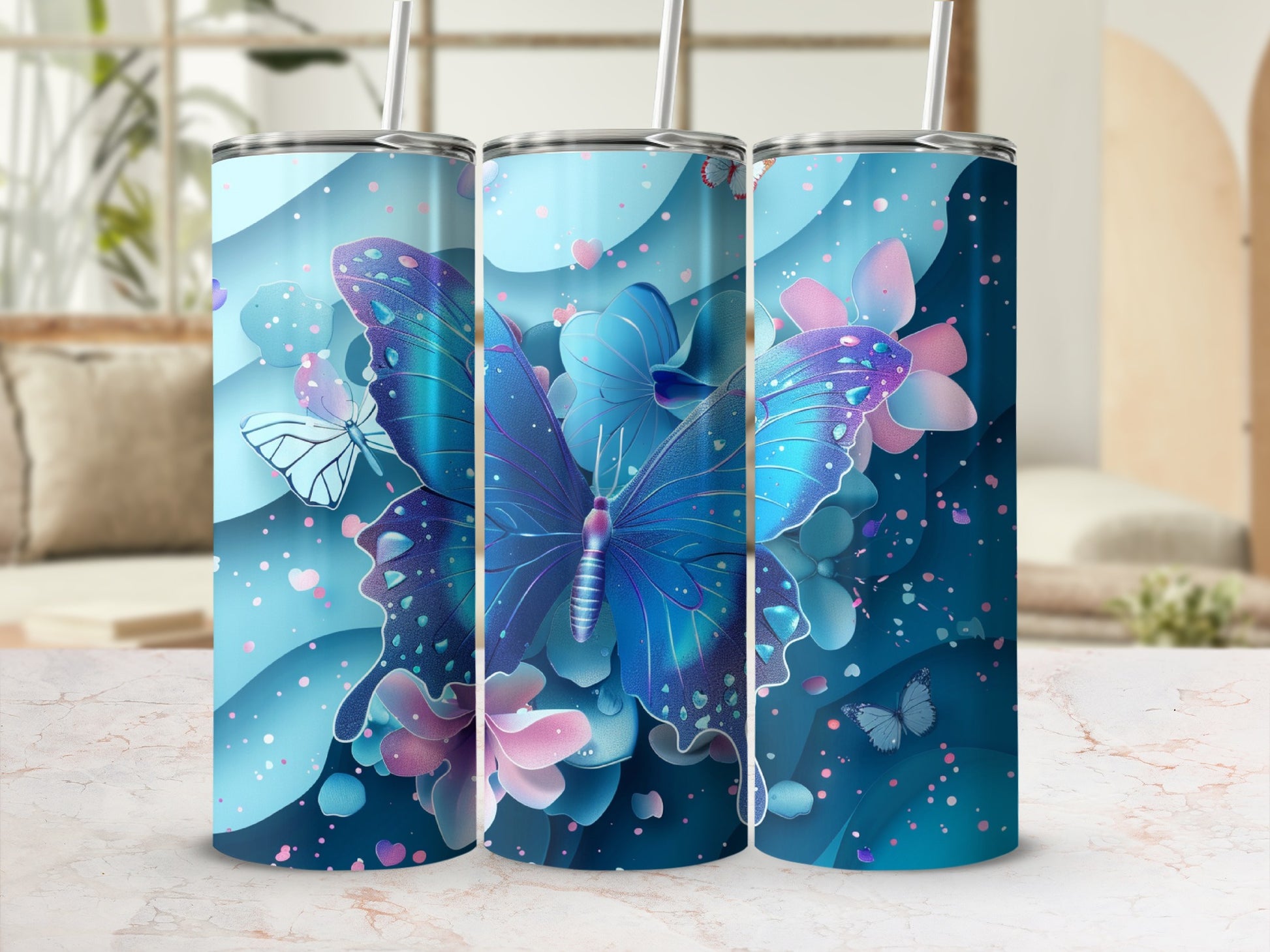 Blue butterfly and floral design on a blue tumbler with straw.