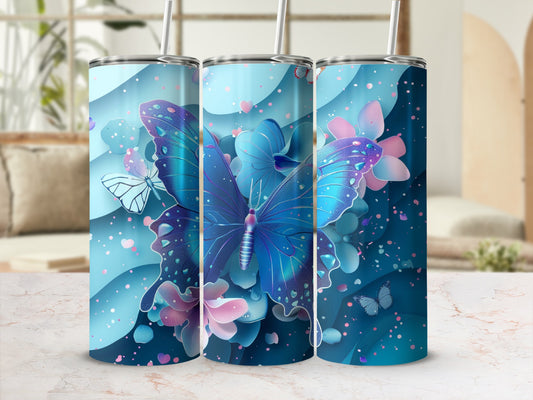Blue butterfly and floral design on a blue tumbler with straw.