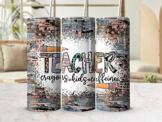 Teacher tumbler with "Teacher, crayons, kids, caffeine" text and pencils.
