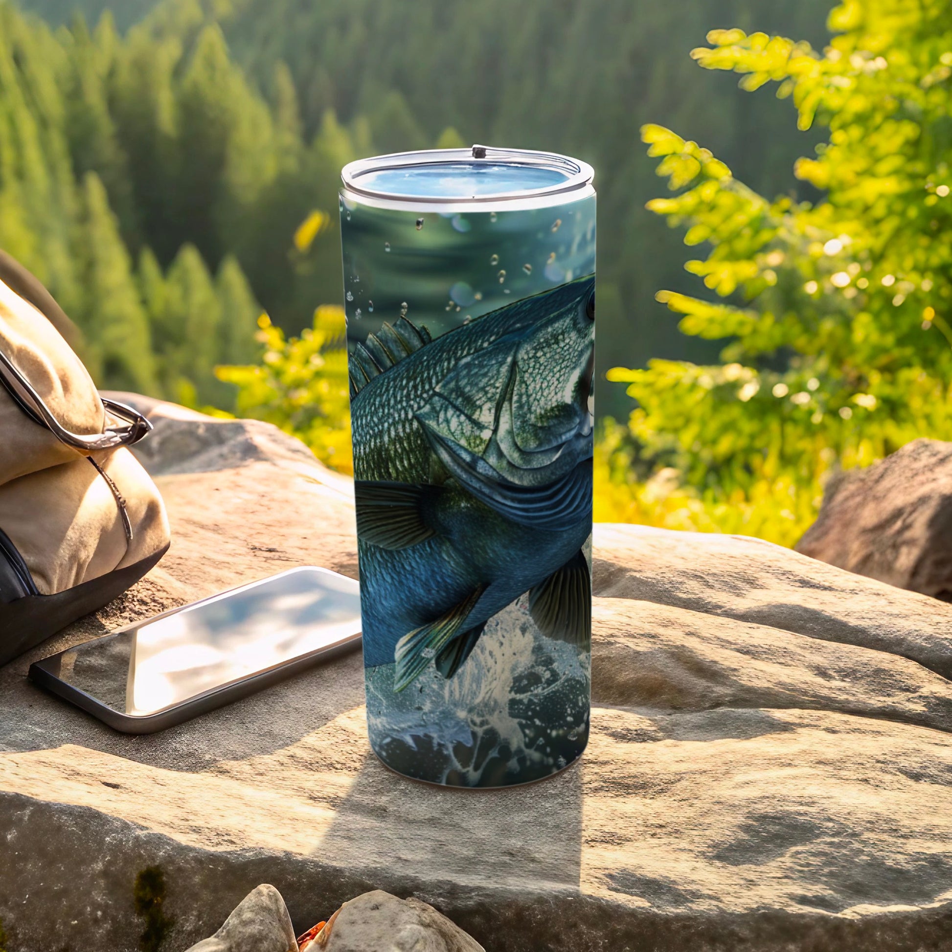 Close-up of a bass jumping out of water on a travel tumbler.