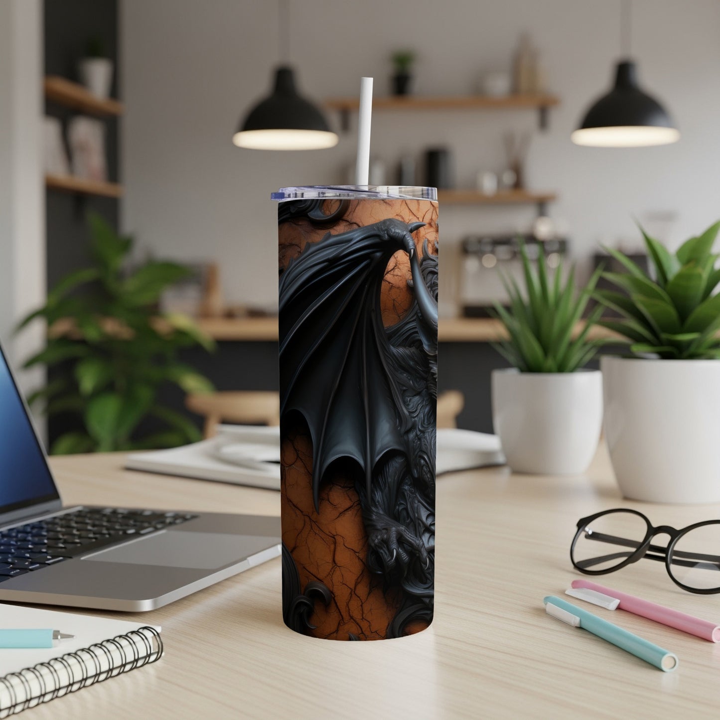 Tumbler with embossed black dragon design on a cracked orange background.