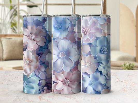 Three tall tumblers with a floral pattern in blue and pink.