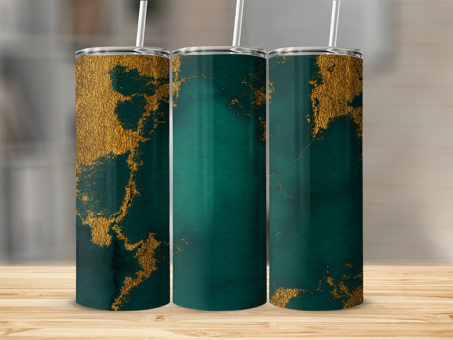 Three tumblers with abstract gold and dark teal marbling designs.