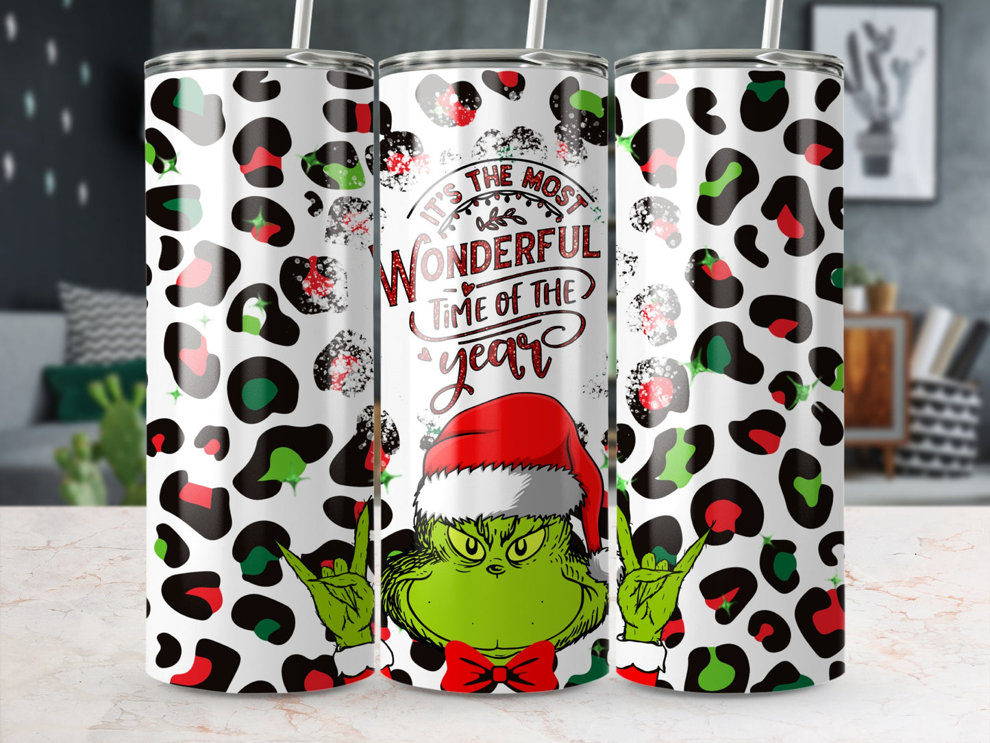 The Grinch in a Santa hat with "It's the most wonderful time of the year" text.