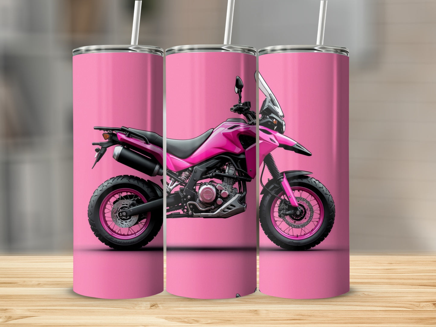 Pink motorcycle design on three tall, pink tumblers.