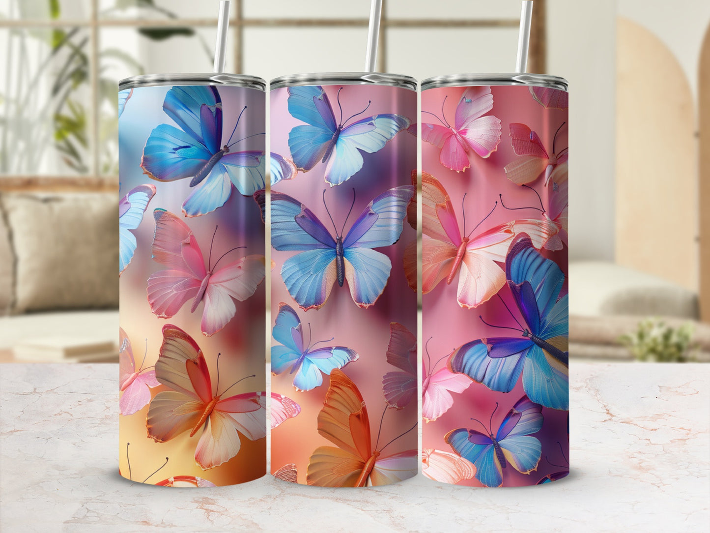 Three tumblers with colorful butterfly designs, showing pastel blues, pinks, and oranges.