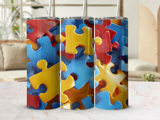 Three tumblers with a colorful puzzle piece pattern.