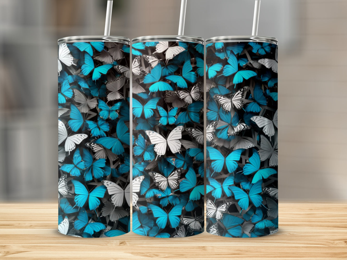 Three tumblers with a repeating pattern of blue and white butterflies.