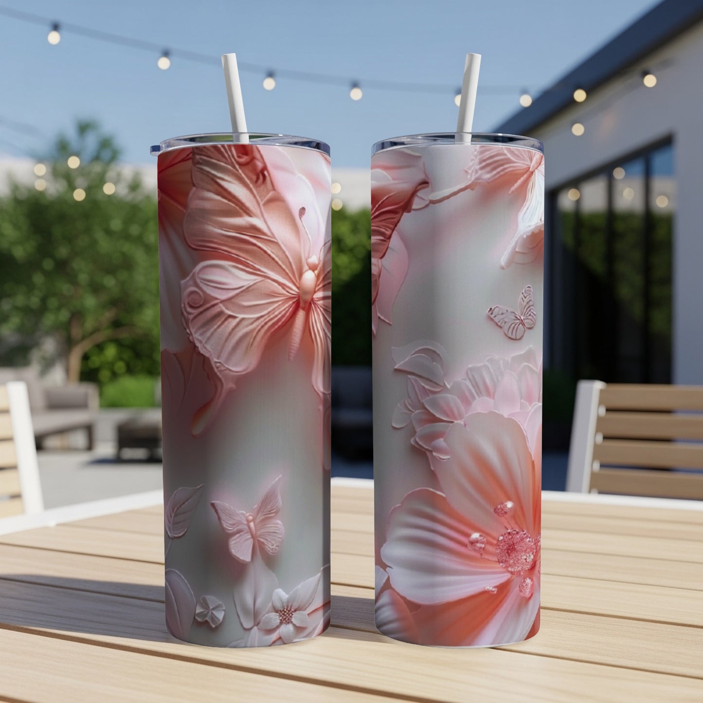Two tall tumblers with embossed floral and butterfly designs.