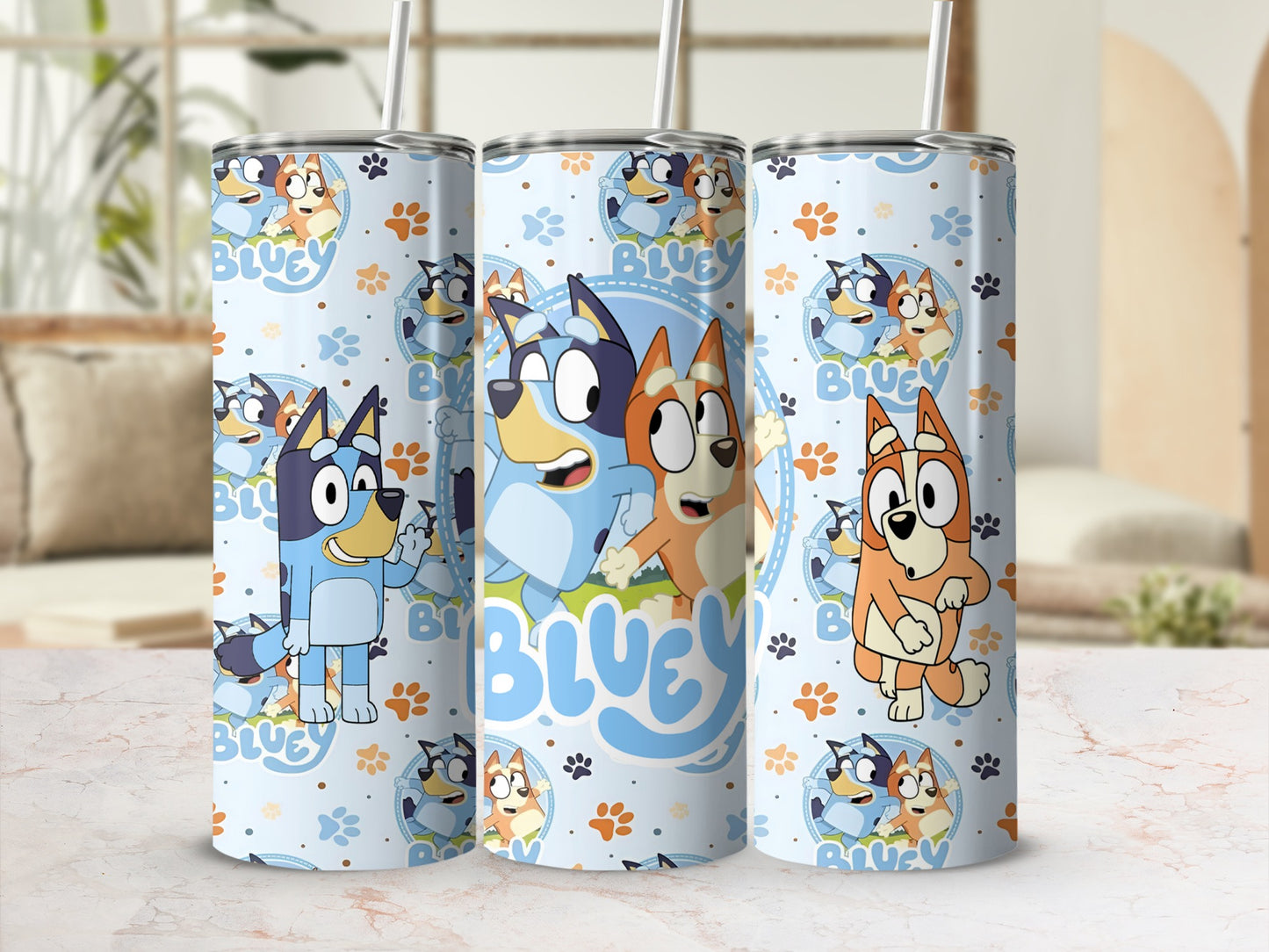 Bluey and Bingo characters on a light blue patterned tumbler with straw.