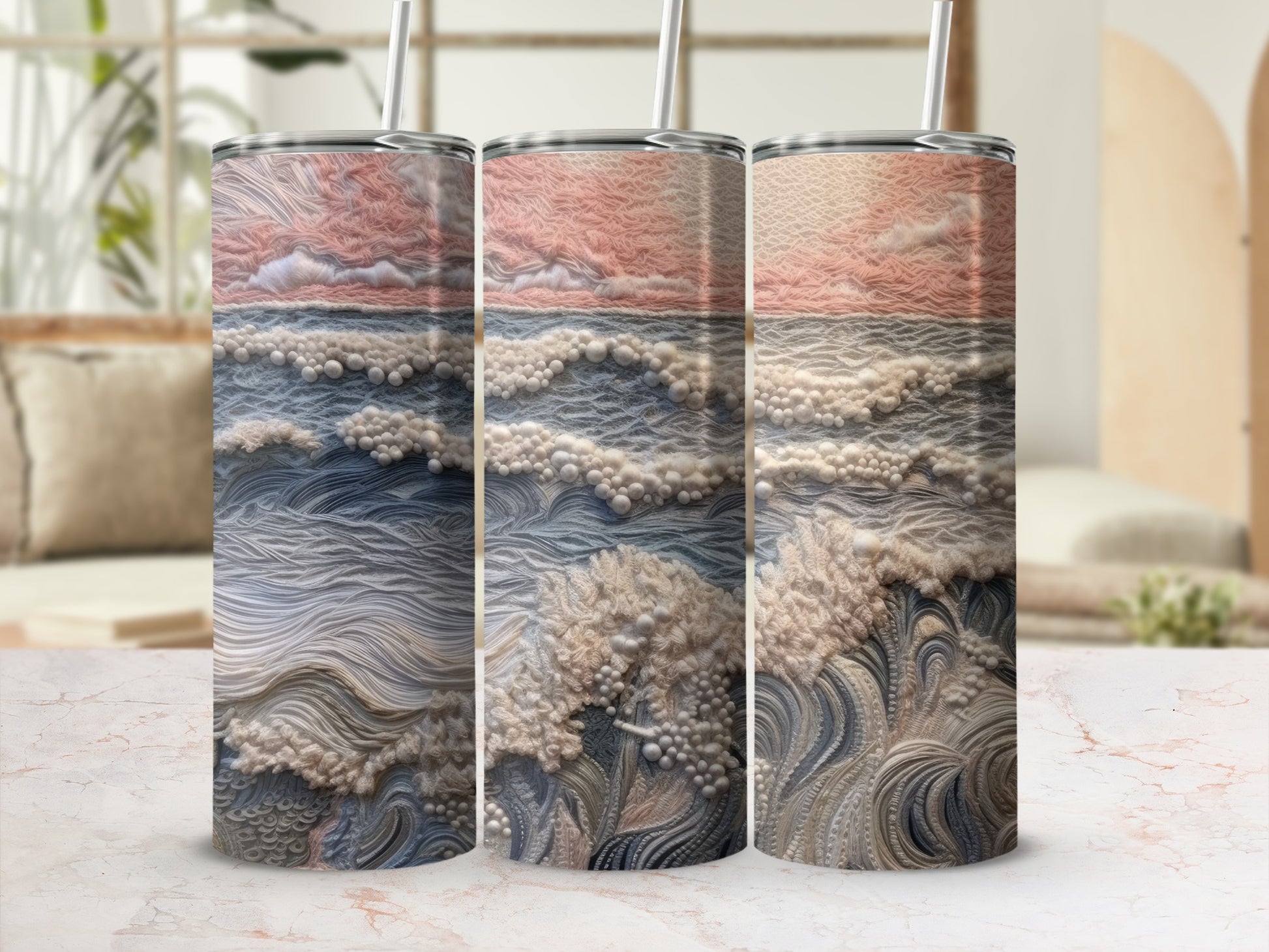 Three tall tumblers with a textured, abstract landscape design in pink and blue hues.