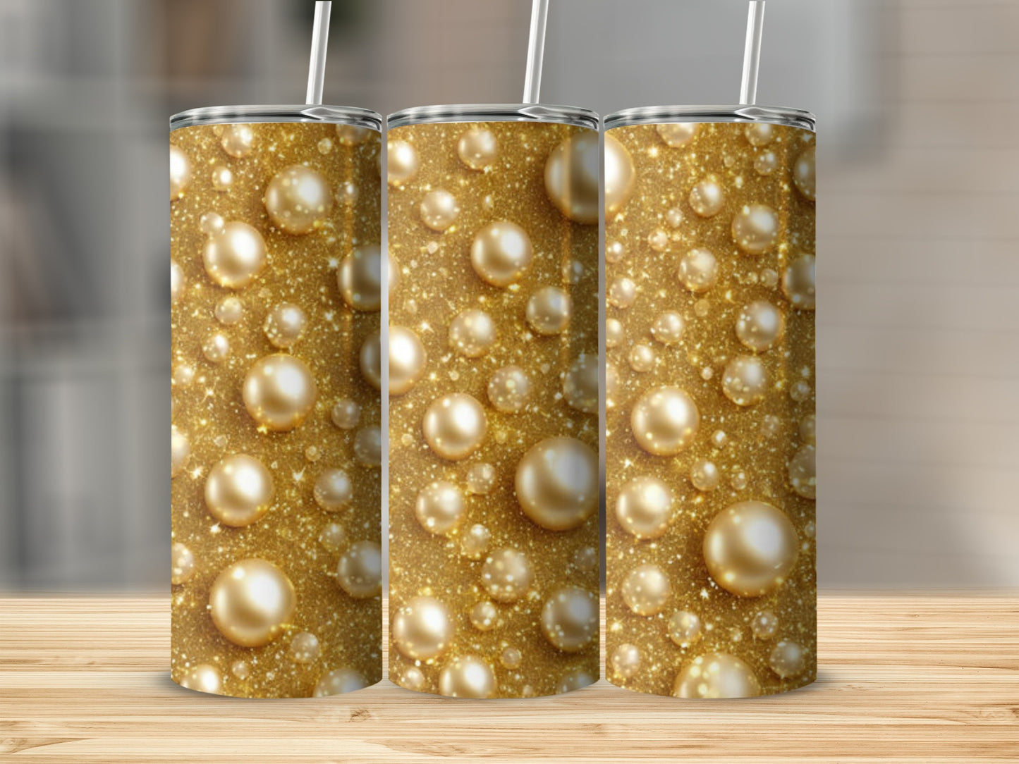 Gold glitter and pearl pattern on three tumblers.