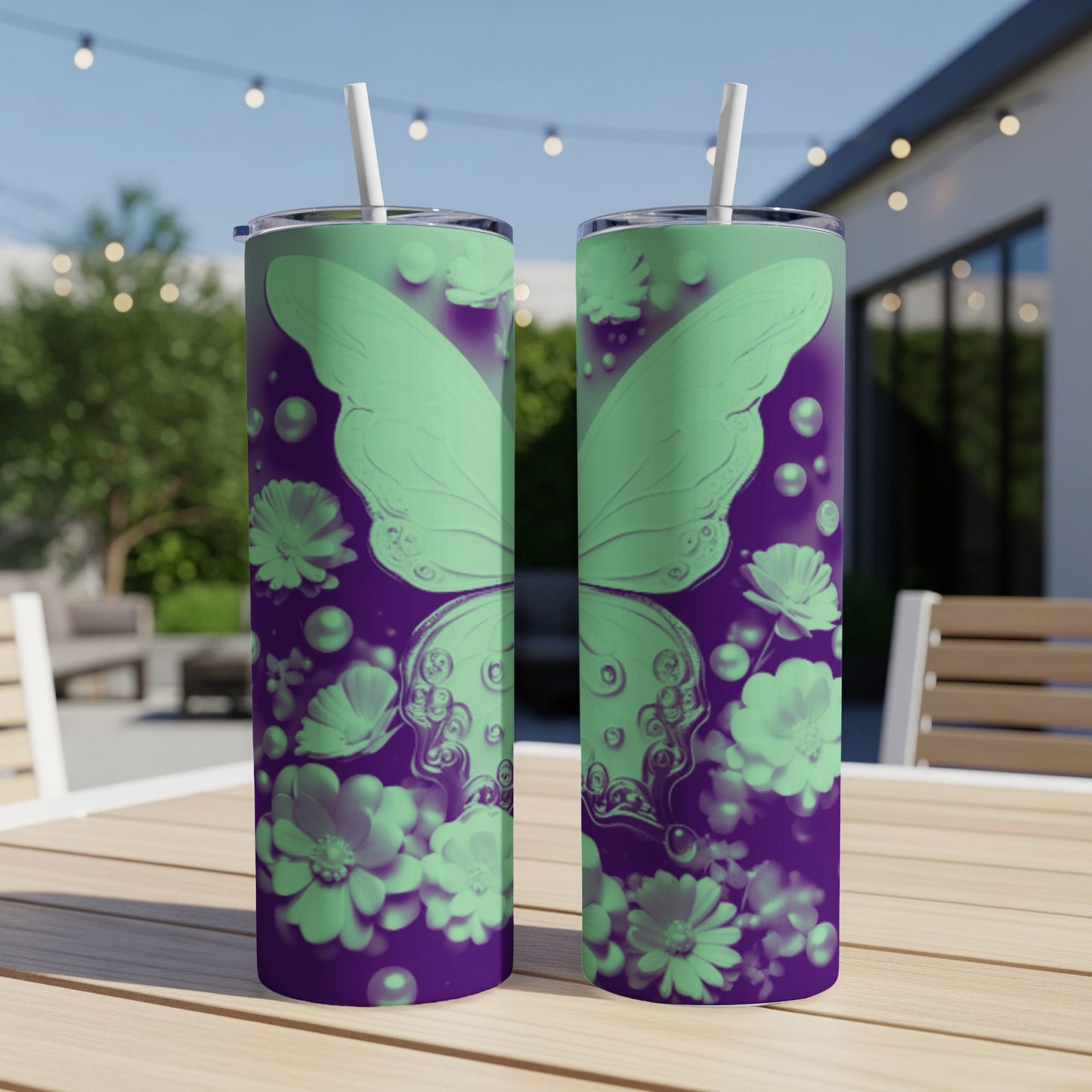 Two mint green tumblers with a butterfly and floral design on purple background.