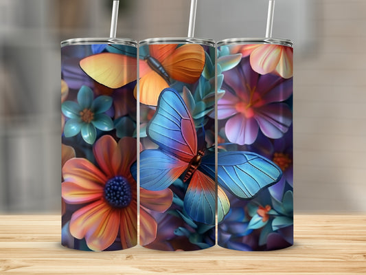 Three tumblers with colorful butterflies and floral designs.