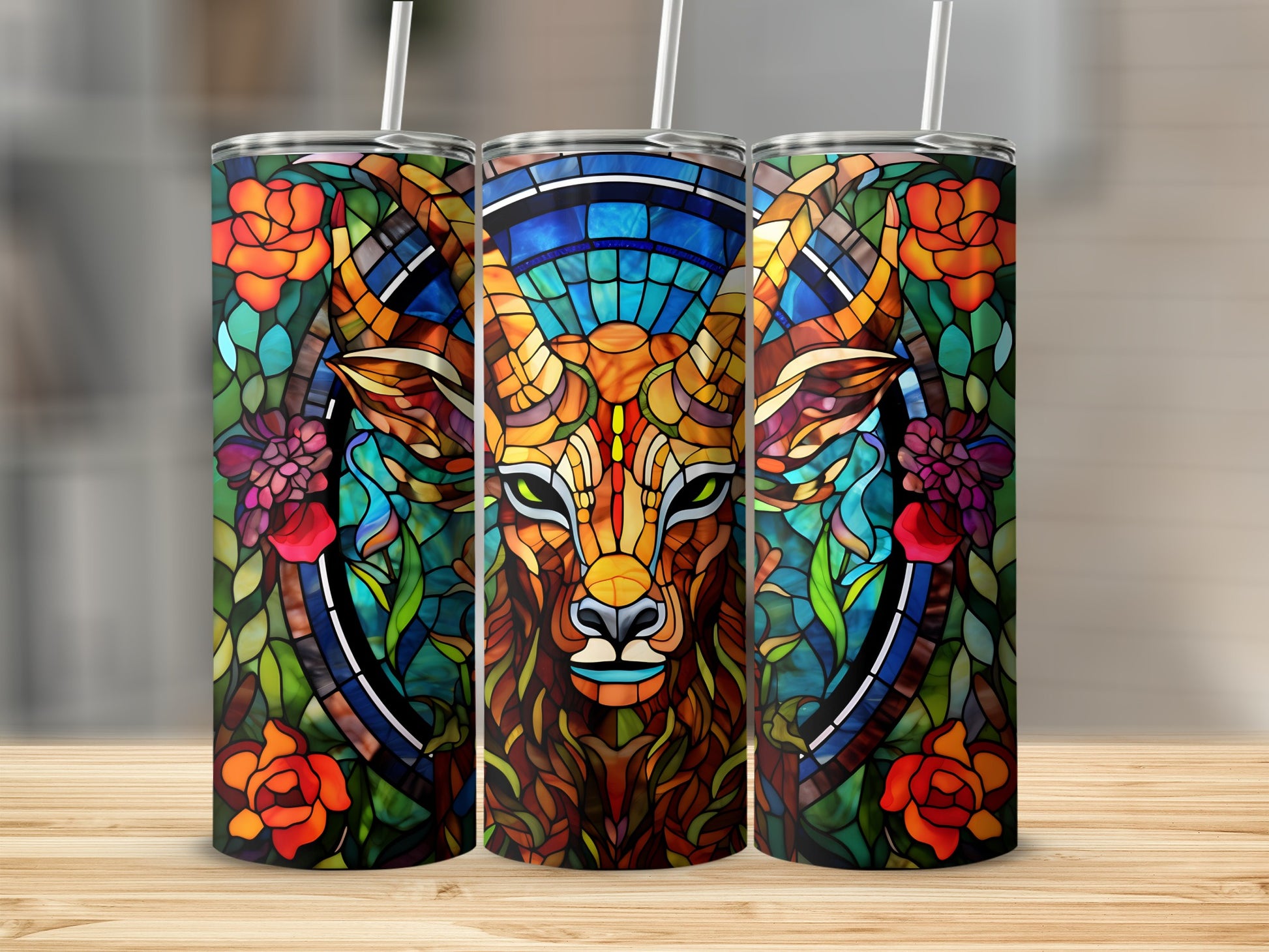 Triptych of tumblers with stained glass deer and floral designs.