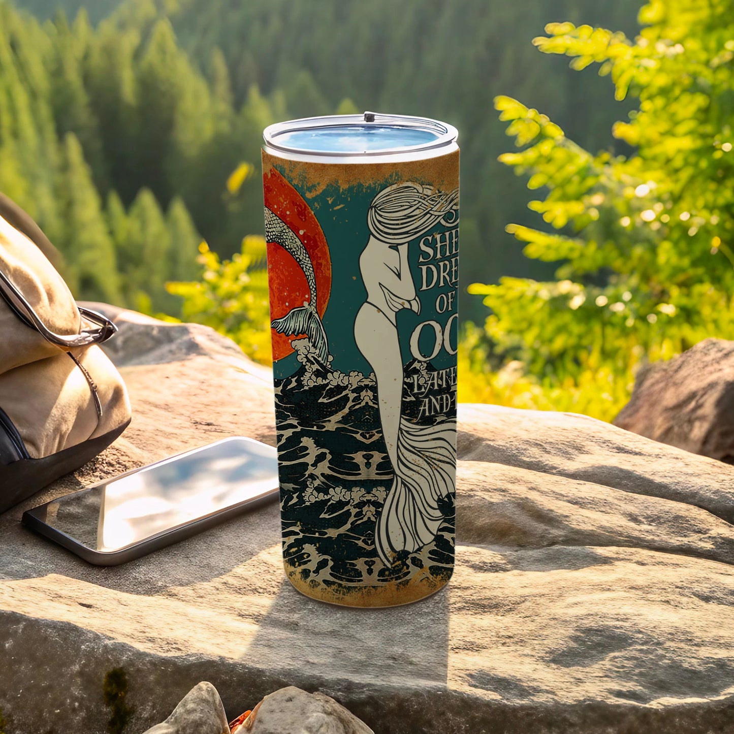 Mermaid and text "She Dreams of Ocean" on a reusable insulated tumbler.