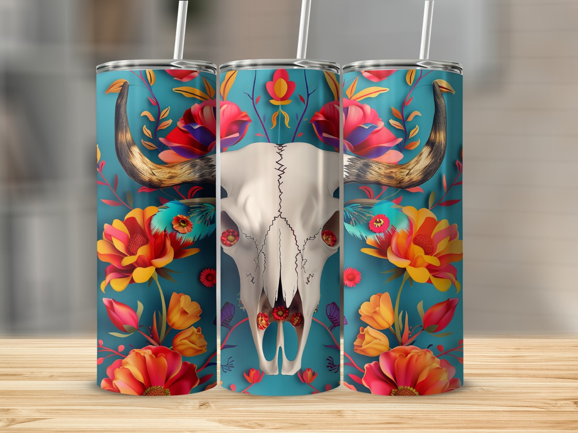 Cow skull with colorful floral accents on a teal tumbler.
