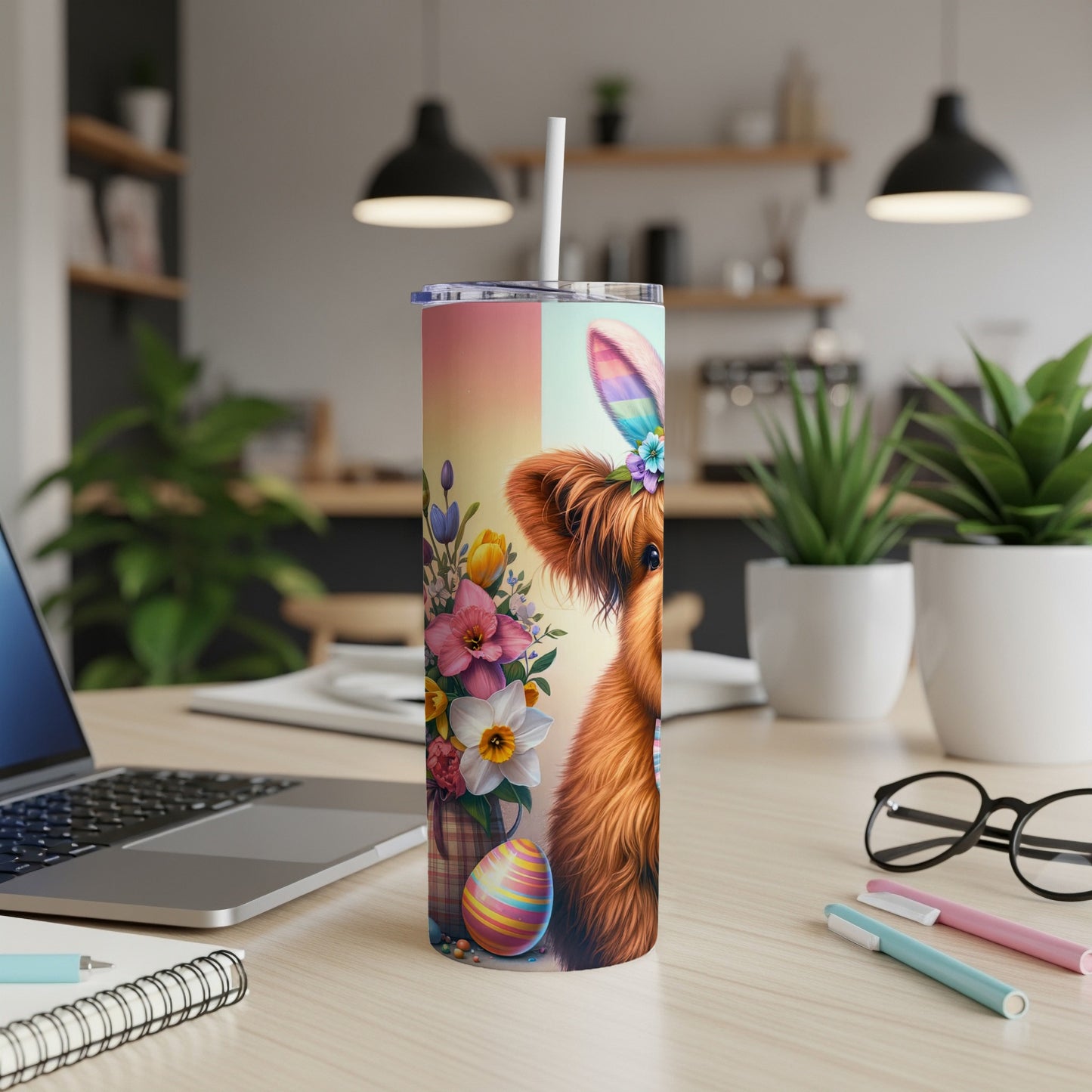 Highland cow with Easter bunny ears and flowers on a tumbler.