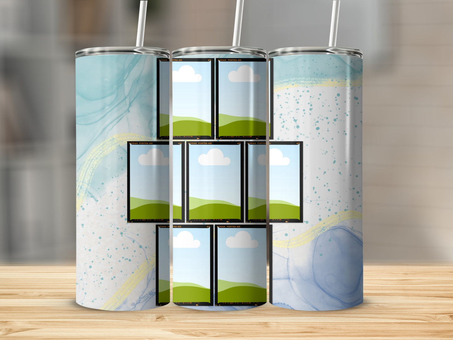 Tumbler with abstract blue watercolor design and multiple film strip photo placeholders.