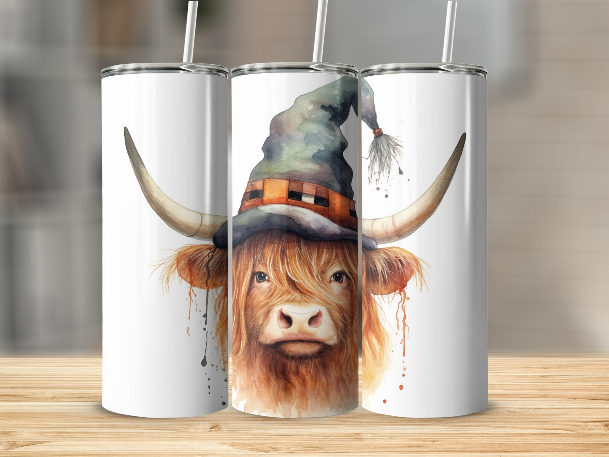 Highland cow with witch hat watercolor design on a tumbler.