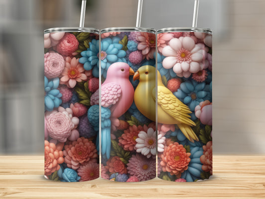 Two colorful birds perched among floral patterns on a tumbler.