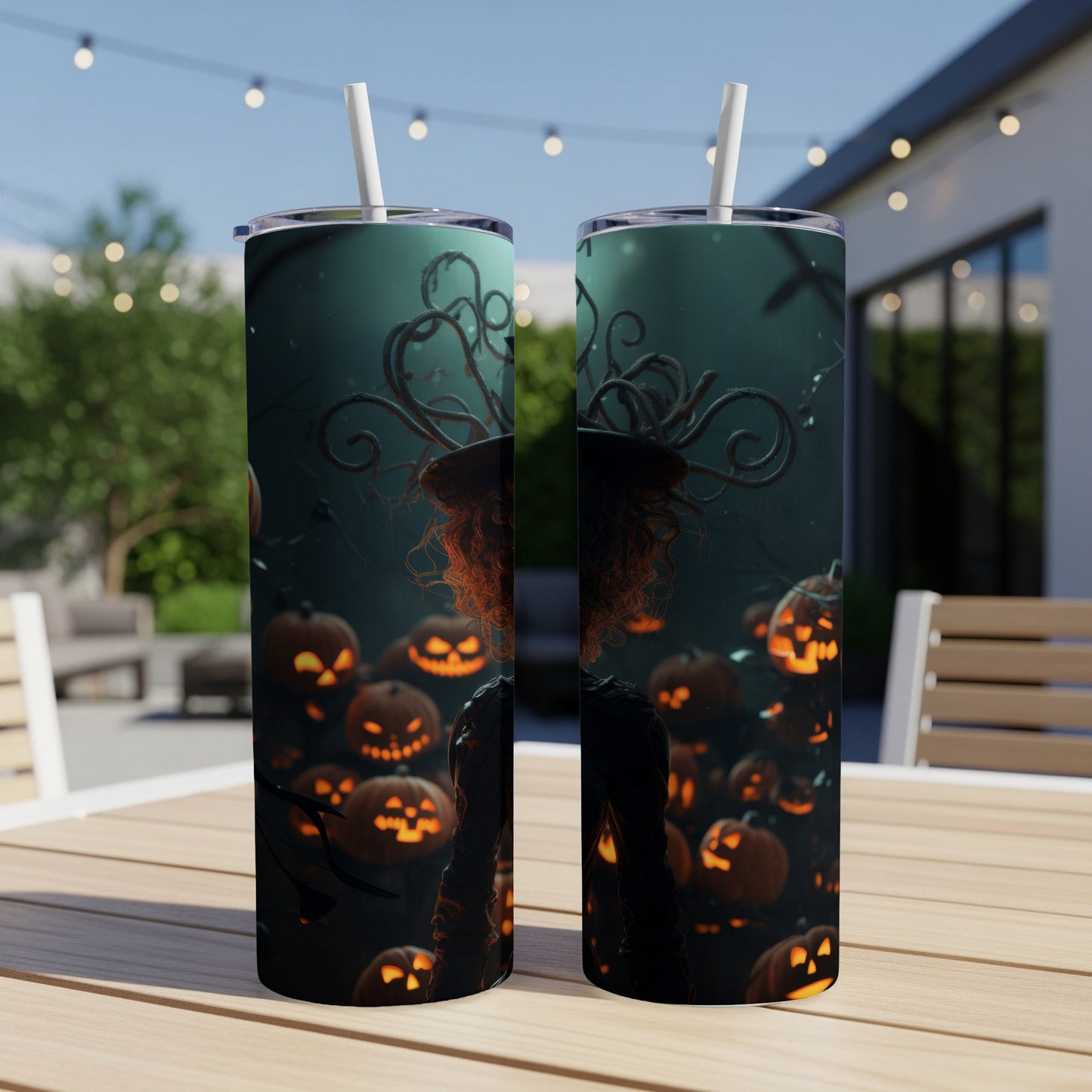 Two tumblers with a spooky Halloween witch and carved pumpkins design.
