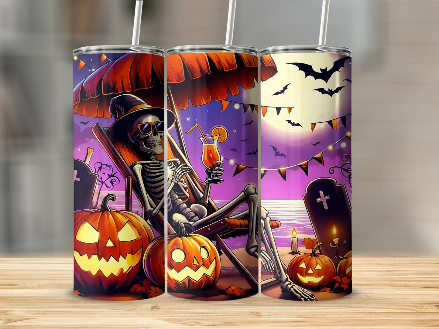 Halloween tumblers with skeleton on beach, pumpkins, bats, and moon.