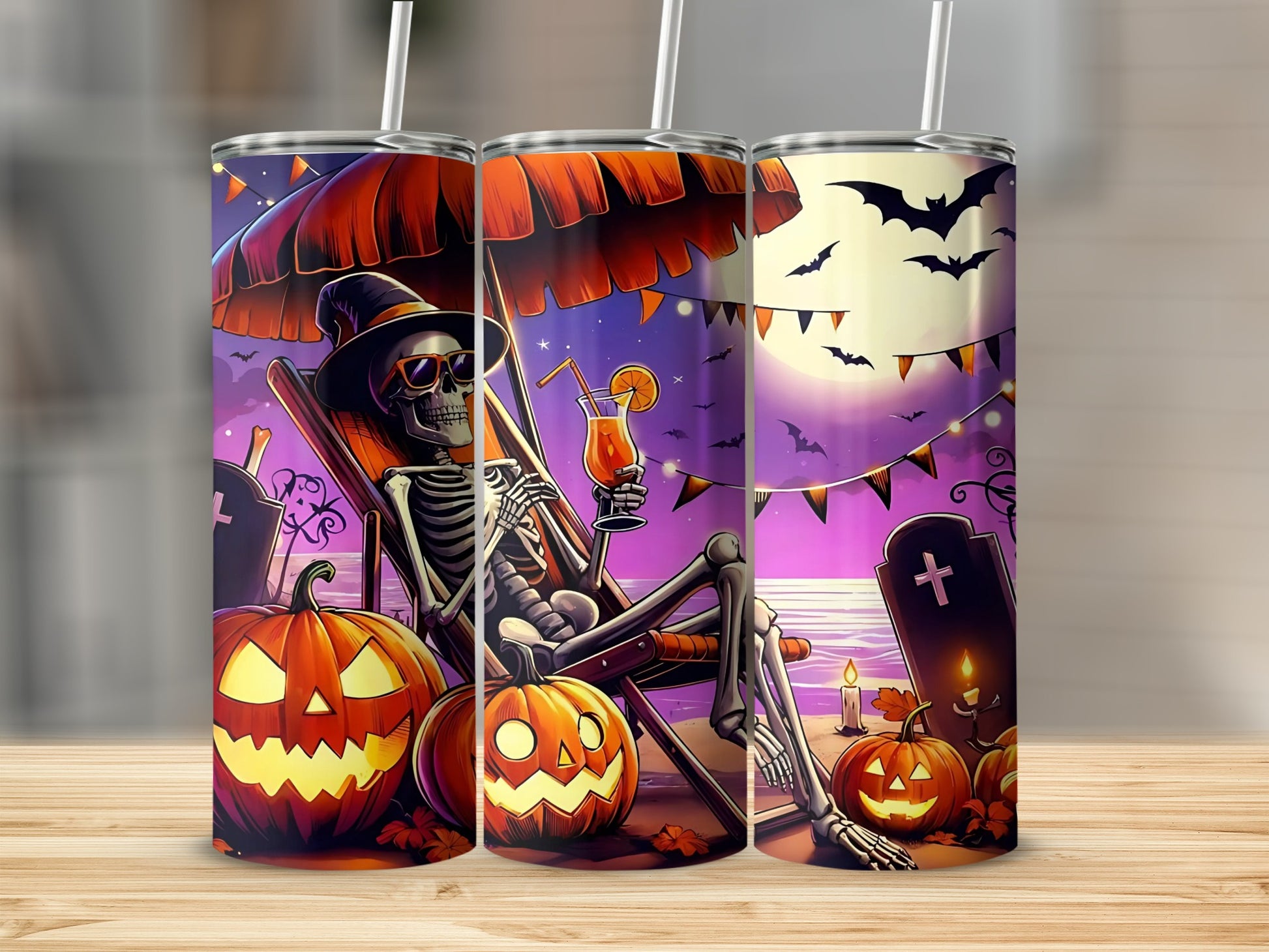 Halloween tumblers with skeleton on beach, pumpkins, bats, and moon.