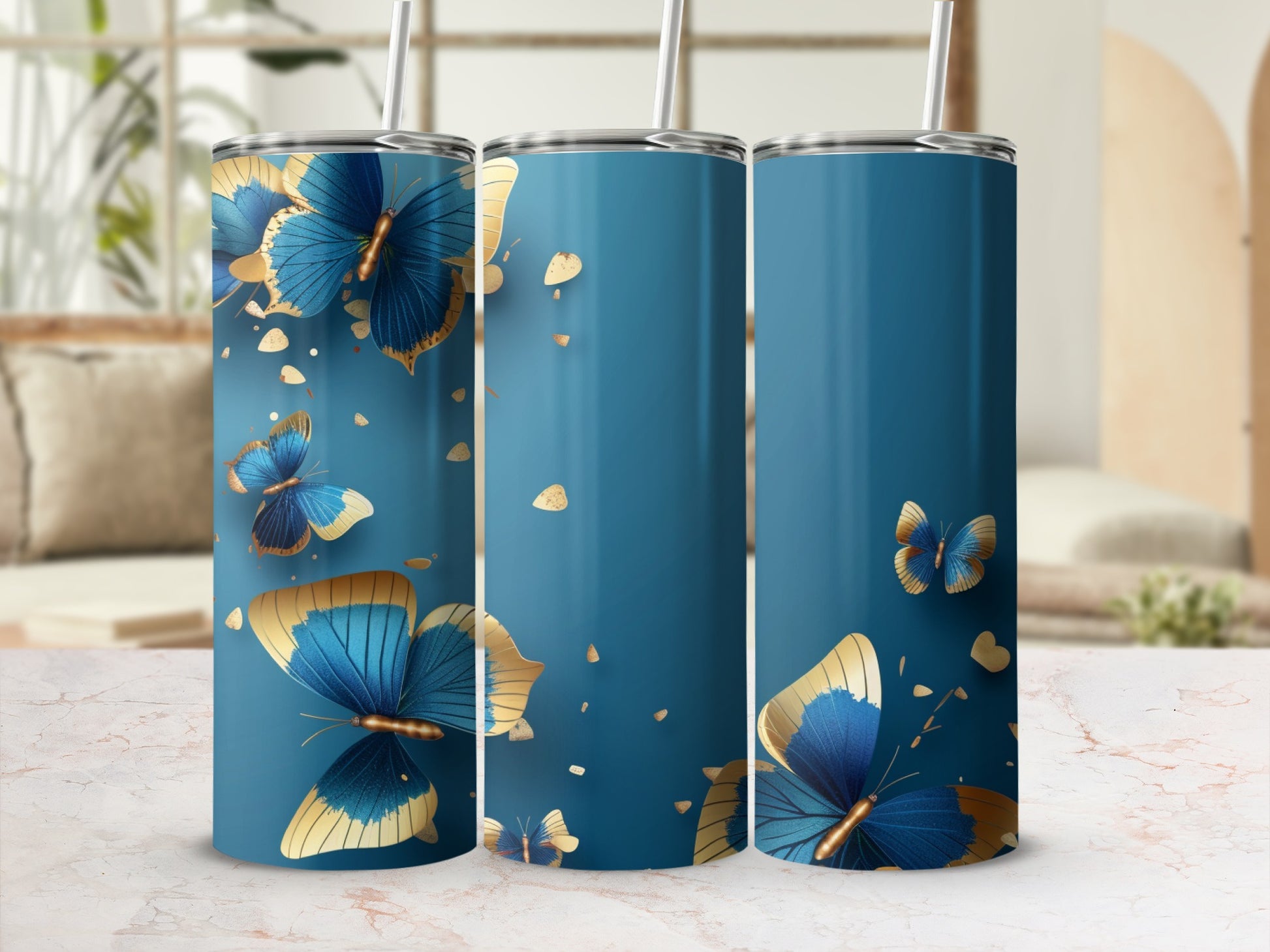Blue tumbler with gold butterflies and scattered gold dots.