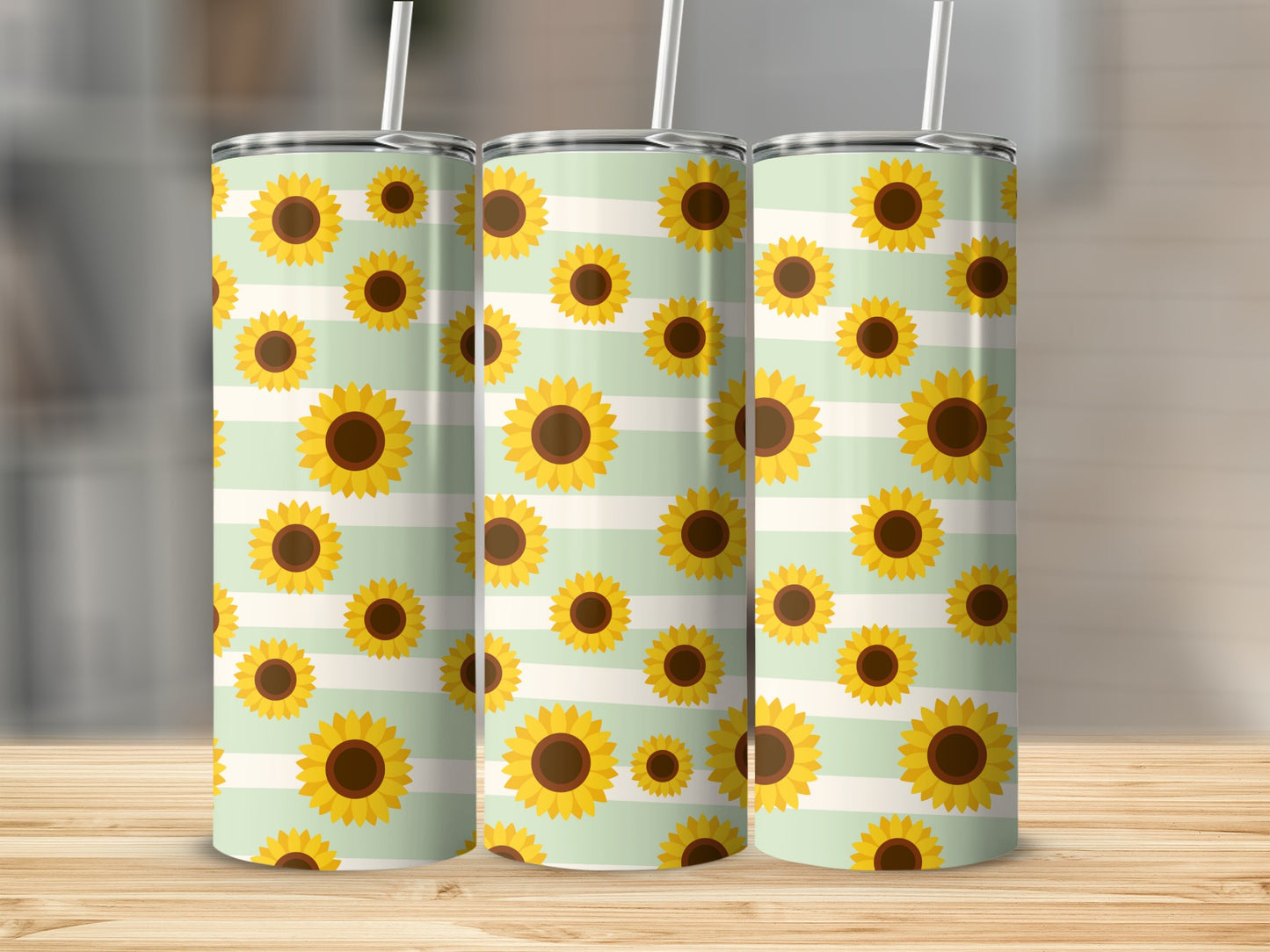 Three tumblers with a pattern of sunflowers on light green and white stripes.