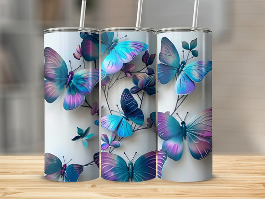 Three tumblers featuring a colorful butterfly pattern on a white background.