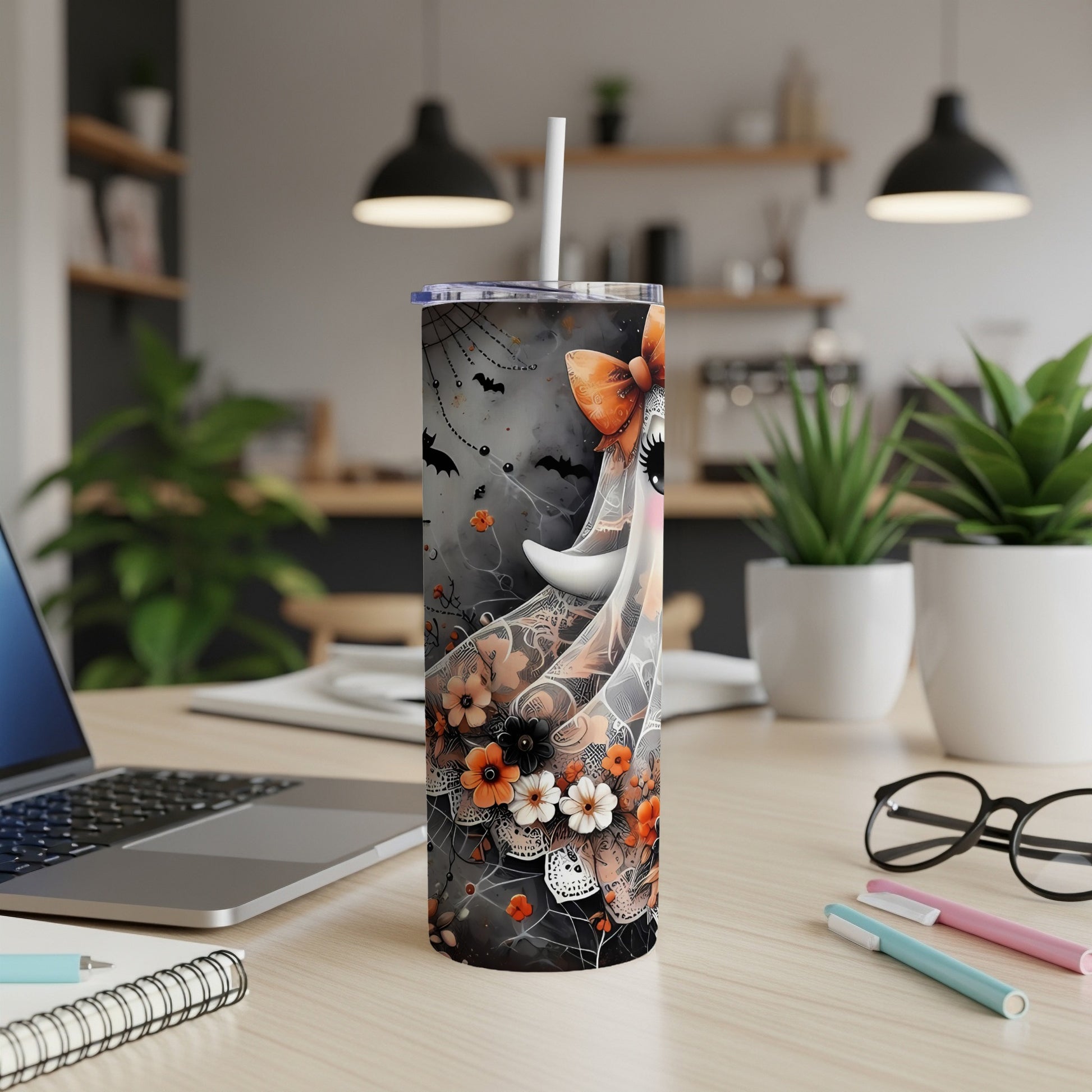 Halloween tumbler with ghost, bats, flowers, and cobweb design.