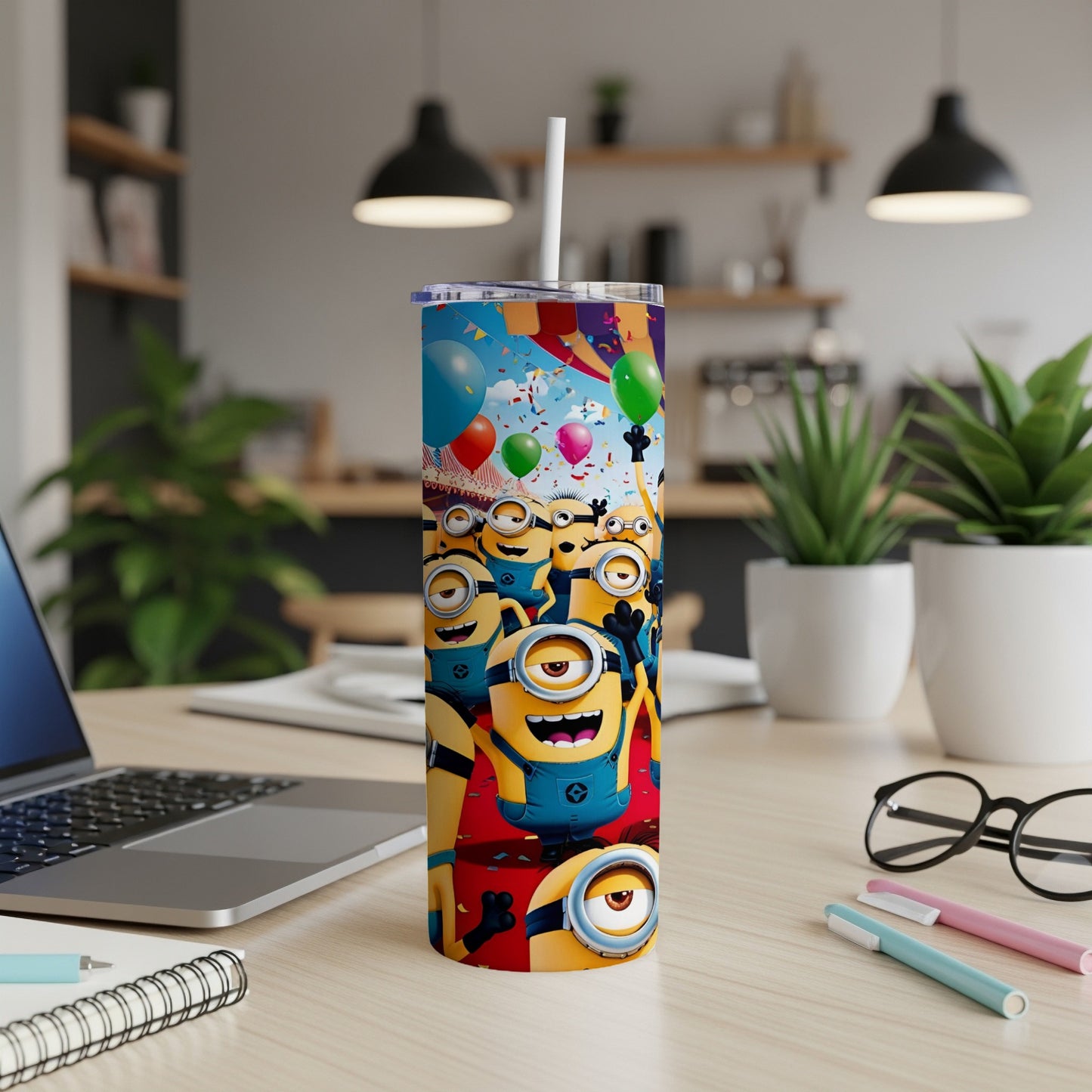 Minions celebrating with balloons on a yellow tumbler with a white straw.