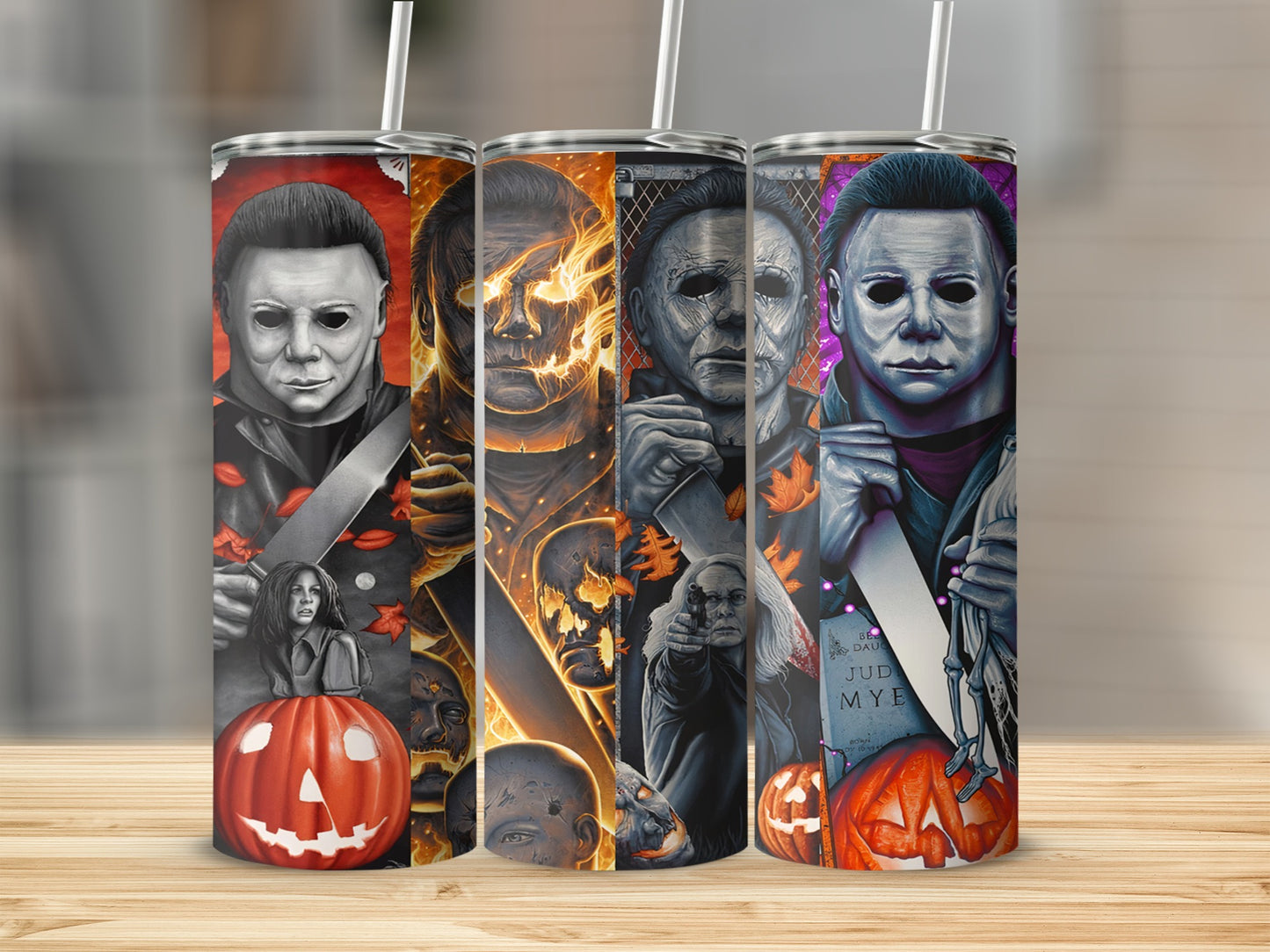 Michael Myers Halloween themed tumblers with pumpkins, tombstones, and scary faces.