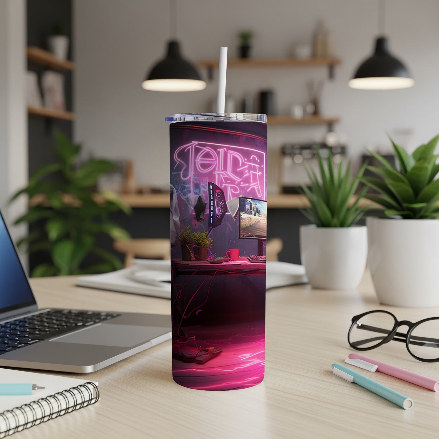 Neon-lit desk setup with laptop, computer monitor, and tumbler.