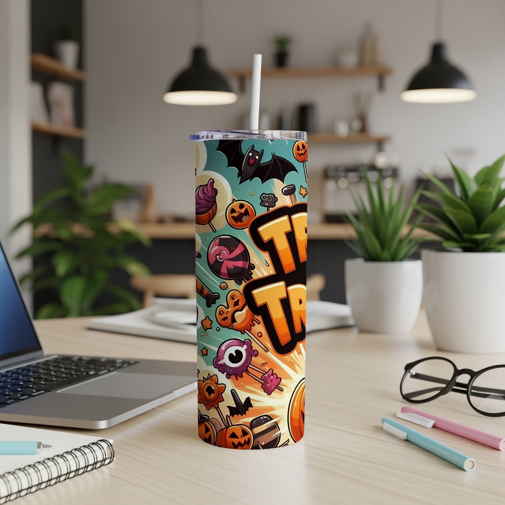 Halloween tumbler with "Trick or Treat" text and cartoon holiday graphics.