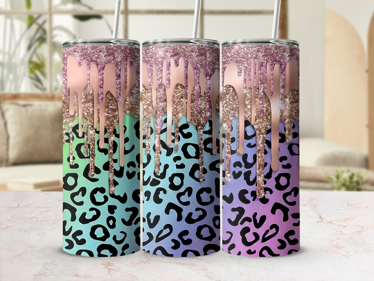Three leopard print tumblers with glitter drip effect.