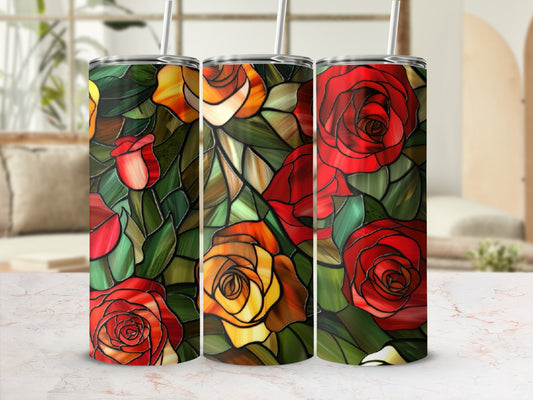 Three tumblers with stained glass rose pattern and straws on a marbled surface.