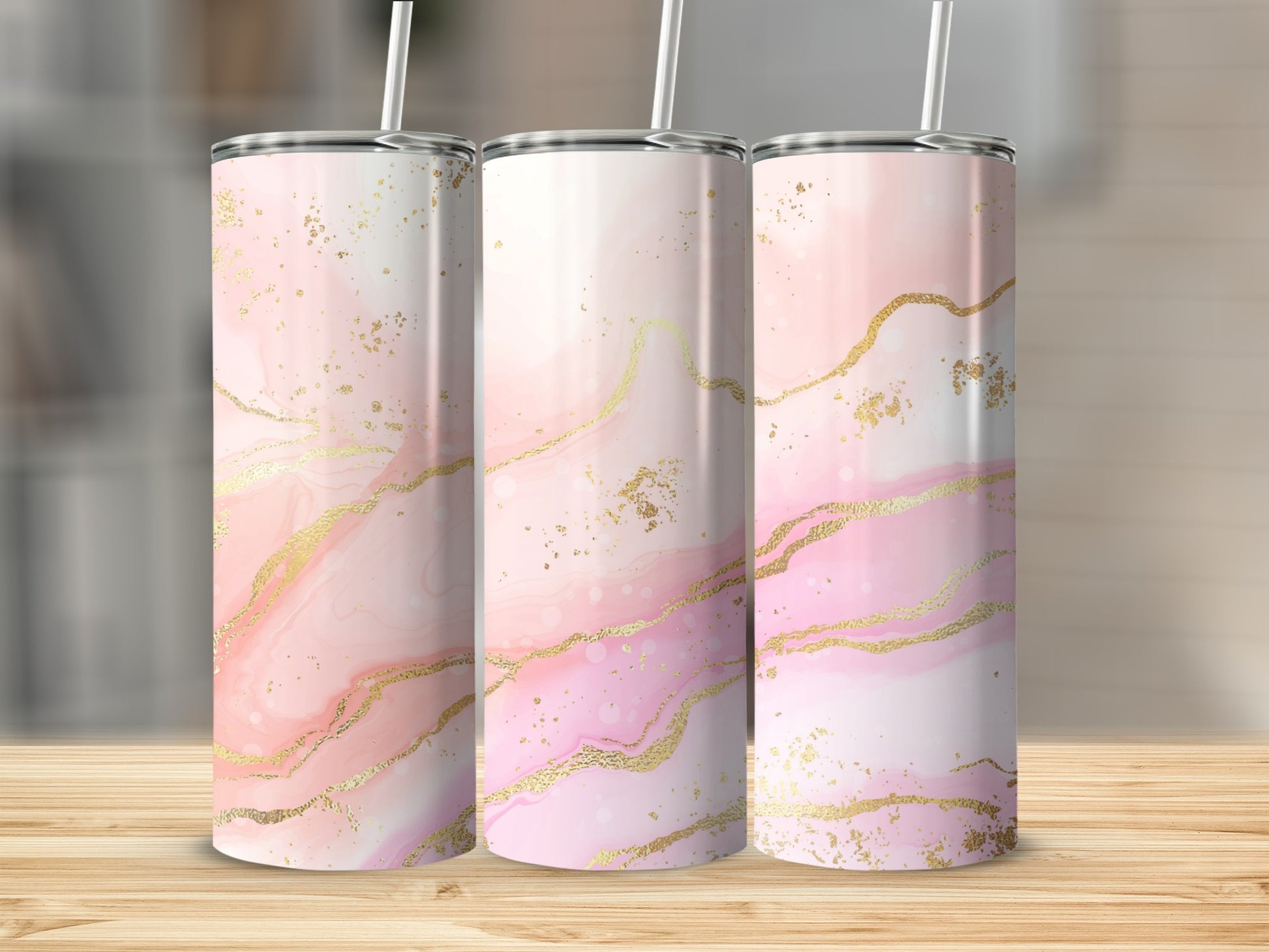 Three tall tumblers with pink marble and gold glitter design.