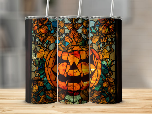 Stained glass pumpkin tumbler with floral and leaf accents.