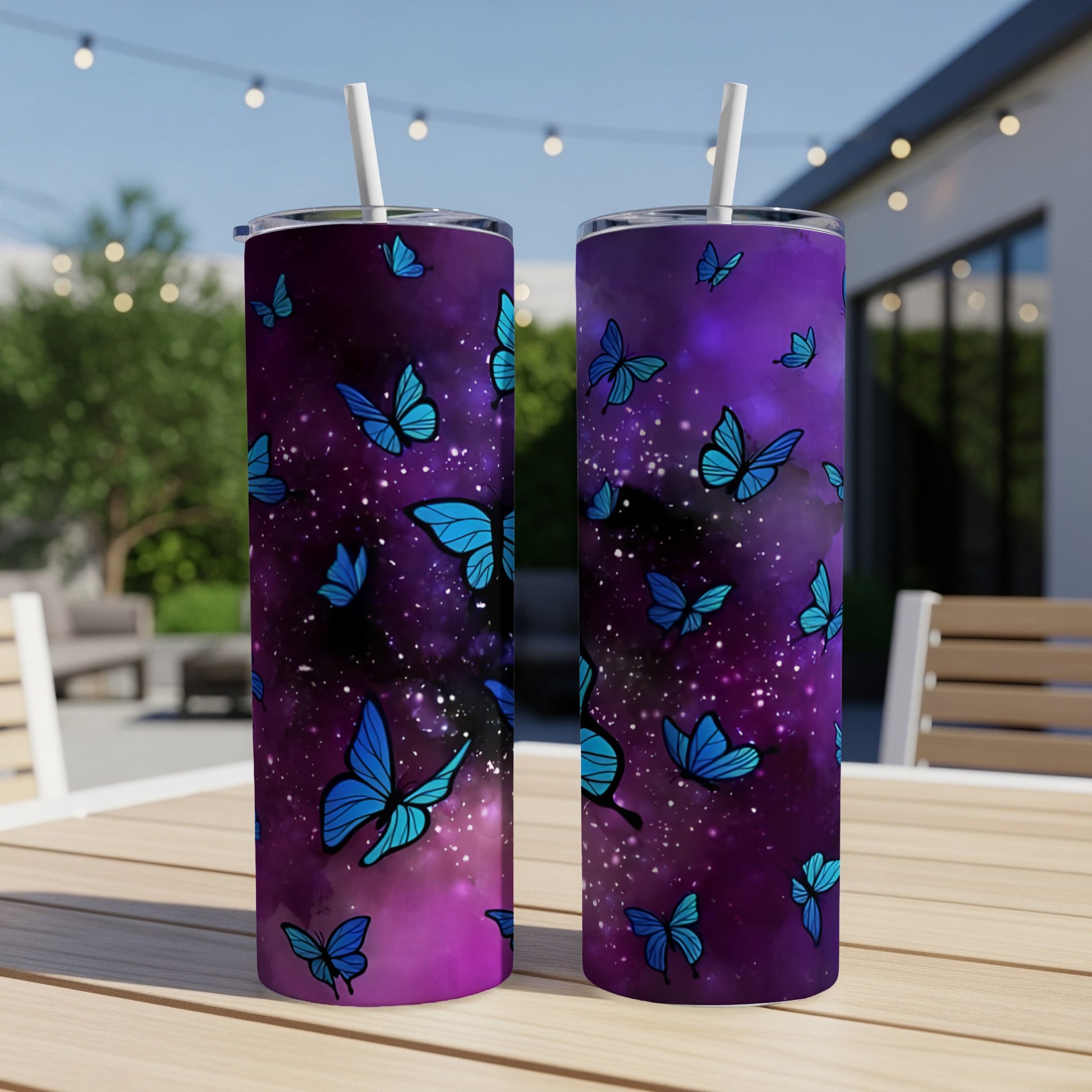 Two tumblers with a purple and blue galaxy pattern and blue butterflies.