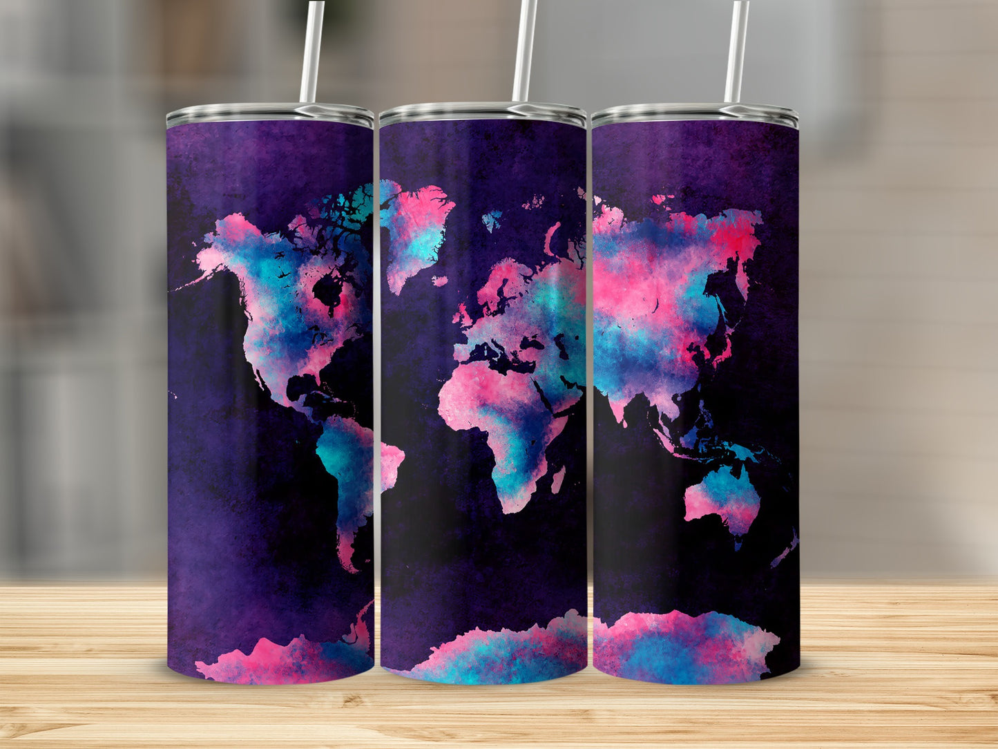 Three tumblers with a colorful world map design in pink and blue.