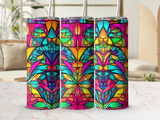 Colorful stained-glass pattern on three identical tumblers with straws.