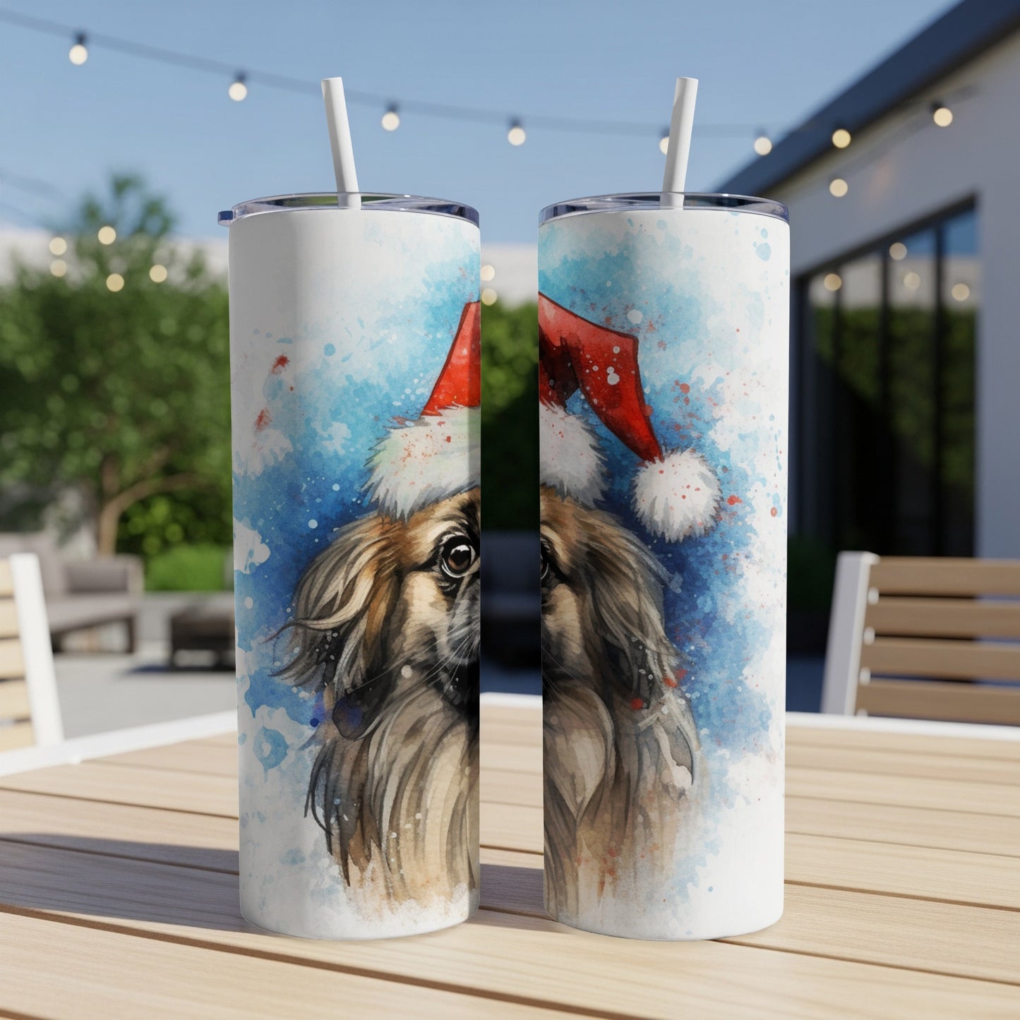 Christmas dog watercolor art on two tall white tumblers with straws.